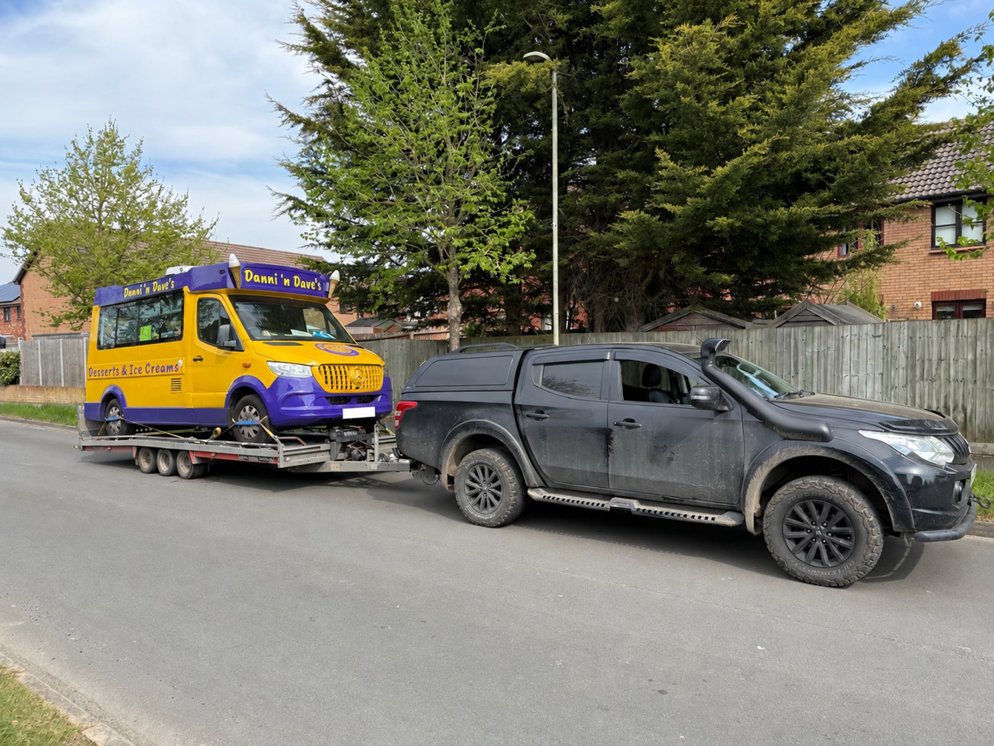 Yellow and purple ice cream van secured on a CSG vehicle trailer